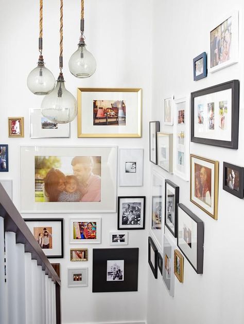 Try a gallery of photos in varying sizes #hgtvmagazine http://www.hgtv.com/decorating-basics/when-emily-henderson-designs-your-home/pictures/page-3.html?soc=pinterest تحت الدرج, Gallery Wall Staircase, Emily Henderson Design, Stairway Decorating, Display Family Photos, Eclectic Gallery Wall, Emily Henderson, Design Del Prodotto, A3 Size