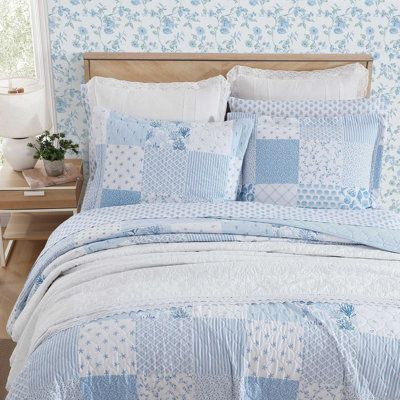 Introducing the Laura Ashley Colleen's Coastal Patchwork Cotton Quilt Set - a captivating combination of coastal allure and timeless design. Elevate your bedroom with the enchanting beauty of this quilt set, meticulously crafted to bring a touch of seaside elegance to your room décor. Colleen's coastal patchwork boasts a harmonious blend of blue tones inspired by the tranquility of the ocean. From darker blues to lighter tones, each patch is intricately arranged to create a visual masterpiece th Double Bed Comforters, Coastal Granddaughter Bed Sheets, Coastal Patchwork Quilt, Bed Set Queen, Costal Grandma Bedding, Comfy Blue Bedroom, Light Blue And White Bedroom Decor, Coastal Bedroom Pillows, Blue Patchwork Quilt