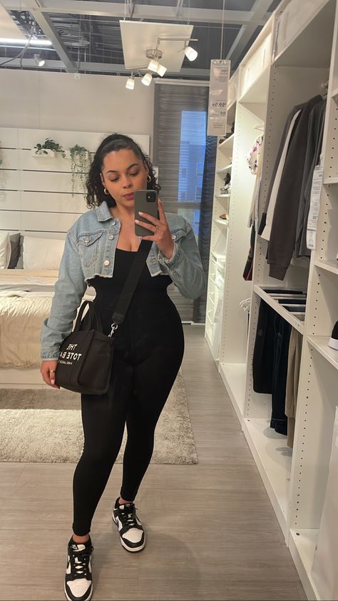 Cute outfit with black jumpsuit, cropped jean jacket and panda dunks, Marc jacobs tote bag on the side. Panda Dunks With Dress, Jumpsuit Outfit With Dunks, Jumpsuit Jordans Outfit, Dunks With Jumpsuit, Romper And Dunks Outfit, Black And White Pandas Nike Outfit, Panda Outfit Ideas, Unitard Outfit Ideas, Outfit Ideas Latina