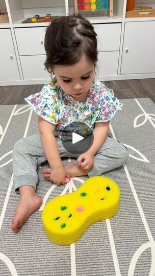 31K views · 930 reactions | 🌈✨Budget-friendly activity using an item you probably have at home! Click the ✨FOLLOW✨ button to continue learning more! 🧚‍♂️

To recreate the activity, grab a large sponge and make slits using a knife. Push in small pom-poms and have your little one pull them out. It’s a great activity to work on fine motor skills. Have fun! ♥️

➡️Don’t forget to check my “Activities and Milestones Caregiver Guides” - link in bio! ✨

👶🏻👶🏽👶🏾Activity is recommended for approximately toddler-aged children +. Supervision is always required. 

•
•
•

#montessori #montessoriathome #practicallife #toddlerlife #toddleractivity #playbasedlearning #toyrotation #playroom #playroominspo #montessori #montessoritoddler #toys #amazonfinds #playbasedlearning #toddleractivities #kidacti Button Fine Motor Activities, Finger Gym Activities Preschool, Tactile Activities, Finger Gym, Playbased Learning, Motor Skills Activities, Skills Activities, Practical Life, Montessori Toddler