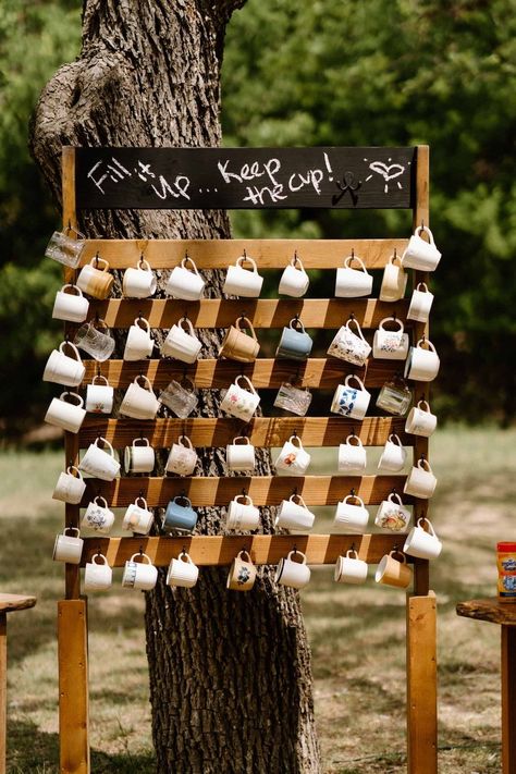 Thrifted mugs make a fabulous, eco-friendly favor. | Elm Pass Woods - Wedding Festivals Center Point, TX Laid Back Fall Wedding, Fairytale Woods Wedding, Wedding Fun Things, Eco Friendly Backdrop, Woodsy Engagement Party, Cheap Backyard Wedding Reception, Wedding At A Brewery, Dry Wedding Ideas, Cheap Wedding Ideas On A Budget Diy