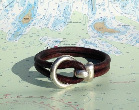 Browse unique items from SailwindsTradingCo on Etsy, a global marketplace of handmade, vintage and creative goods. Ocean Sports, Maine Gifts, Nautical Bracelet, Cool Presents, Jolly Roger, Unique Items, Holiday Gift Guide, Leather Cord, Arm Band