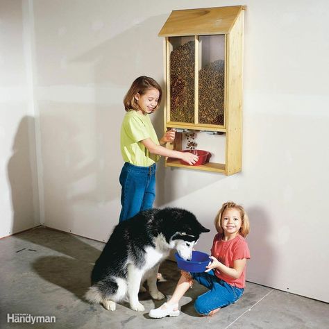 Build this bin and you can fill the dog dish with the flick of a finger and do away with that crumpled bag of dog food lying on the garage floor. This bin easily holds two 20-lb. bags of food and allows you to dispense it right into the dish. And you can store two types of food so the cat won’t get jealous. Slide open the Dog Food Dispenser, Pet Food Dispenser, Garage Update, Diy Dog Food, Pet Food Storage, Food Dog, Food Dispenser, Garage Makeover, Diy Dog