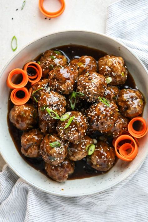 These homemade teriyaki meatballs are a FUN and easy recipe to make, requiring less than 10 ingredients. Plus, we include a delicious and cleaned-up homemade teriyaki sauce recipe that provides the iconic sweet-salty and gooey-delicious glaze that teriyaki dishes are known for. Quick Meatball Recipes, Teriyaki Dishes, Quick Meatballs, Teriyaki Meatballs Recipe, Healthy Ground Beef Recipes, Teriyaki Sauce Recipe, Real Food Dietitians, Teriyaki Meatballs, Healthy Ground Beef