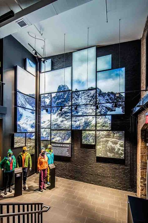 Arc'teryx sells high end outdoor performance clothing and wanted to transport their customer to the outdoors, indoors. SEG Systems achieved this by adding one large piece of landscape photography across 24 wall-mounted lightboxes. This created a window effect: the backlit silicone edge graphic art with gaps in between, which made it look like a giant window looking out to the mountains. #lightbox #retail #collage Sky Box Wall Mount, Fabric Lightbox Black Frame Exhibit, Fabric Lightbox, Retail Wall Displays, Digital Window Display Screens, Transparent Led Display, Modular Display System, Led Screen Wall Exhibition, Modular Display