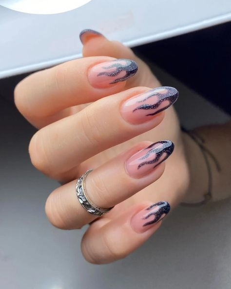 Fiery Fashion: Black Almond Nails with Flame Art 🔥🖤 A bold and dramatic look. These black almond nails with flame art are perfect for those who love a unique and edgy style. #flamenails #blacknails #almondnails #nails #nailart #manicure #pedicure #nailinspiration #naildesigns #beauty #fashion #style #manchesterunited #sundaynight #dallascowboys #blackalmondnails Black Almond Nail Designs, Almond Nail Designs, Black Almond Nails, Almond Nails French, Nail Designs Ideas, Nail Place, Baby Blue Nails, Short Almond Nails, Matte Black Nails