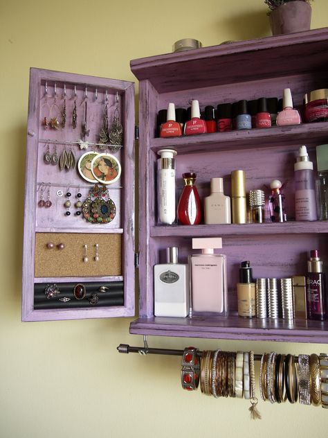 "This is a jewelry organizer / cabinet designed and crafted by me. Functional with an artistic flare is my goal when making functional pieces. Something you can use every day and be well-pleased to display in your bedroom or elsewhere as a piece of art. Designed on LILAC DISTRESSED color, is meant to hold numerous jewelry along with cosmetics, lotion and make up. On the left door 's interior side there are hooks and wires for about 30 earrings of any length and a cork board for easily displaying Make Up Organizing, Jewelry Organizer Cabinet, Organizer Cabinet, Easy Diy Room Decor, Cute Diy Room Decor, Organizer Jewelry, Wall Organizer, Pinterest Room Decor, Jewelry Cabinet