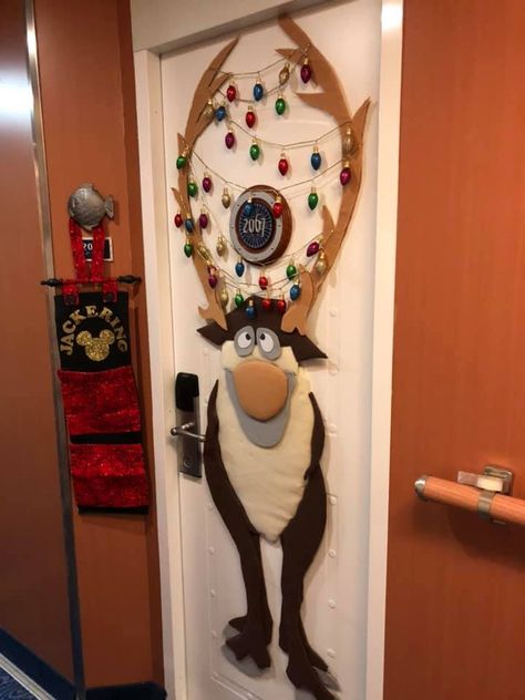 Frozen's Sven Cabin Door for our Christmas Cruise - felt covered, padded cardboard pieces with glitter "lights" garland in the antlers. I wanted something unique that was packable and reusable. It was a big hit!  It was inspired by the graphic from "Frozen Ever After" of Sven with his antlers tangled in lights. Disney Window Decoration, Frozen Christmas Decorations, Famous Christmas Movies, Preschool Door Decorations, Cabin Door Decorations, Door Christmas Decorations, Cruise Door Decorations, Disney Cruise Door Decorations, Diy Christmas Door Decorations