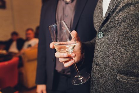 Men's hand holding wine glass at festive... | Premium Photo #Freepik #photo #hand #hands #wine #celebration Man Holding Wine Glass Reference, Hand Holding Glass Reference, Hand Holding Wine Glass Reference, Holding Wine Glass Reference, Holding Wine Glass Pose, Hand Holding Glass Of Wine, Holding Reference, Reference Hands, Holding A Glass Of Wine