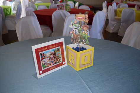 Table Decor Toy Story, Toy Story Gift Table, Easy Toy Story Centerpieces, Toy Story Theme Centerpieces, Toys Story Centerpieces, You Story Centerpieces, Toy Story Table Decorations Centerpieces, Toy Story Guest Book, Toy Story Birthday Centerpieces Diy