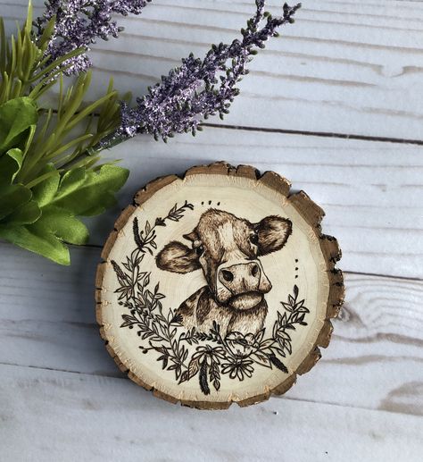 #woodburning #woodburningart #cowart #flowers #spring #cows #decor #farmhousedecor #farmhouse #woodburner #artist #art Cow Wood Burning, Wood Burning Art, Cow Art, Flowers Spring, Watercolor Canvas, Wood Slices, Art Challenge, Pyrography, Flower Wreath