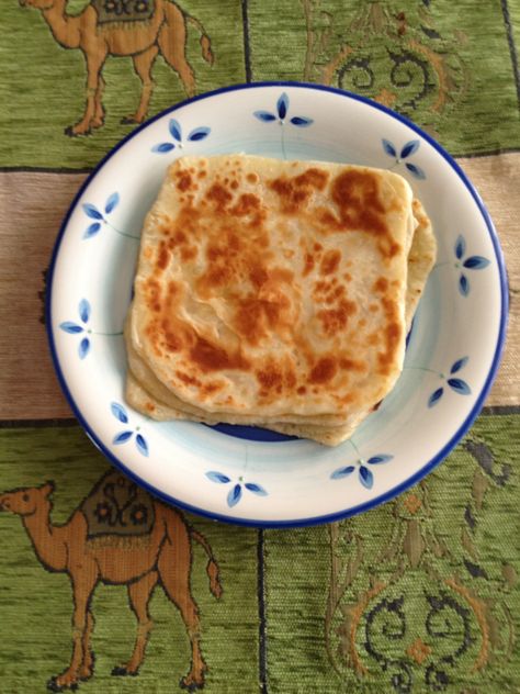 Sabaayad is similar to the Indian paratha. This is versatile bread that can be eaten for breakfast, lunch, dinner or just by itself.  For breakfast it is eaten with muqmad (dried camel jerky) or fried eggs and a cup of Somali shah (tea).  For lunch or dinner it can be accompanied by beef, chicken or vegetable curries. My favourite way to eat it is to drizzle some honey on the sabaayad.  http://www.somalikitchen.com/my-blog/2012/04/sabaayad-somali-flatbread.html Somali Bread, Somali Breakfast, Somalia Food, Somalian Food, Somali Recipe, Indian Paratha, Vegetable Curries, Somali Food, Somali Culture