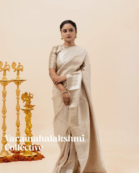 This elegant brocade silk saree features a beautiful blend of traditional Hazel beige with silver zari checks ano thread work, complemented by intricate zari border detailing. The luxurious pallu enhances the sophistication of the entire ensemble. Saree code: CL601422232 Thread Work, Pure Silk, Silk Saree, Silk Sarees, Checks, Thread, Saree, Silk, Silver