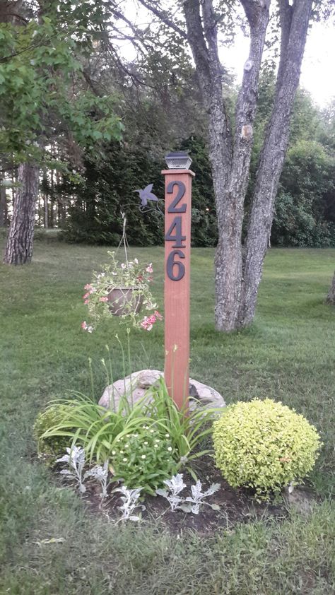 House Number Sign Post Driveway Entrance Signs Diy, House Number Driveway, House Number In Garden, Road Address Sign Ideas, Yard Sign House Number, House Numbers Ideas Outdoor Diy, Pallet House Number Sign, House Number Post Ideas Curb Appeal, Front Lawn House Number