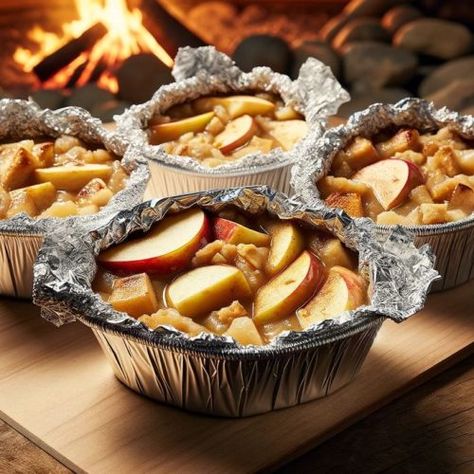 Campfire Apple Crisp Foil Packet Recipe | CampDotCom Campfire Baked Apples, Apple Campfire Desserts, Minnesota Desserts, Glamping Snacks, Camping Thanksgiving Recipes, Summer Camping Food, Campfire Apples, Campfire Apple Crisp, Glamping Food