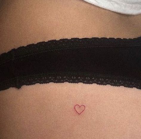 Red Heart Black Outline Tattoo, Red Ink Tattoos Ribcage, Micro Red Heart Tattoo, Small Red Heart Outline Tattoo, Fine Line Red Heart Tattoo, Red Outline Heart Tattoo, Small Red Heart Tattoo On Buttcheek, Lower Back Heart Tattoo, Red Heart Hip Tattoo