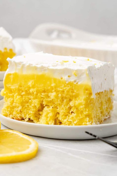 Indulge in this delightfully zesty Lemon Poke Cake! Bursting with fresh lemon flavor and topped with creamy lemon pudding and a layer of Cool Whip, this moist and tangy dessert is the perfect treat for any occasion. Whether you're hosting a party or simply want to satisfy your sweet tooth, this jello cake recipe is sure to be a crowd-pleaser. Marshmallow Poke Cake, Poke Cake Lemon, Lemon Pudding Cake, Moist Lemon Cake, Cake Lemon, Lemon Cake Mixes, Lemon Cake Recipe, Poke Cake Recipes, Lemon Dessert Recipes