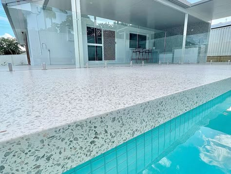 Polished Concrete Around Pool, Tiled Pool Area, Concrete Around Pool Ideas Design, Polished Concrete Pool Surround, Honed Concrete Pool, Terrazzo Pool Deck, Honed Concrete Pool Surround, Kidney Shaped Pool Ideas, Santorini Backyard