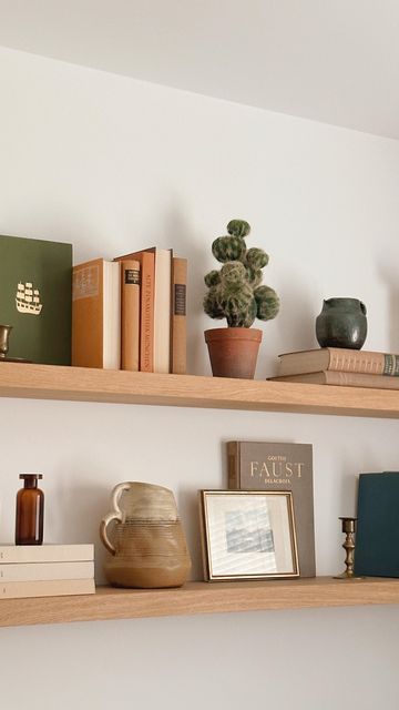 Books Floating Shelves, Oak Floating Shelves Living Room, Thrifted Shelf Decor, Long Shelf Above Couch, Floating Shelves Boho, Floating Shelves Above Couch, Shelf Above Couch, Uni Room Ideas Uk, Shelves Above Desk