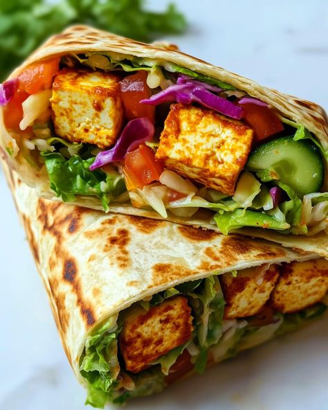 Vegan Tofu Wraps🌯🌱 Fresh, flavourful and vegan? Now that's a wrap!🤤 Follow @plantiful.palate for more recipes🗒️ Recipe: Ingredients: - 200g firm tofu, press and cubed - 1 tbsp olive oil - 1 tsp smoked paprika - 1/2 tsp garlic powder - Salt and pepper, to taste - 4 large tortillas or wraps - 1 cup shredded lettuce - 1/2 cup red cabbage, thinly sliced - 1 tomato, diced - 1/2 cucumber, sliced - 1/2 cup shredded carrots - 1/4 cup vegan mayo or hummus - 1 tbsp lemon juice - Fresh coriander, ch... Tofu Wrap, Tofu Press, Tofu Wraps, Shredded Carrots, Vegan Tofu, Firm Tofu, Vegan Mayo, Shredded Lettuce, More Recipes