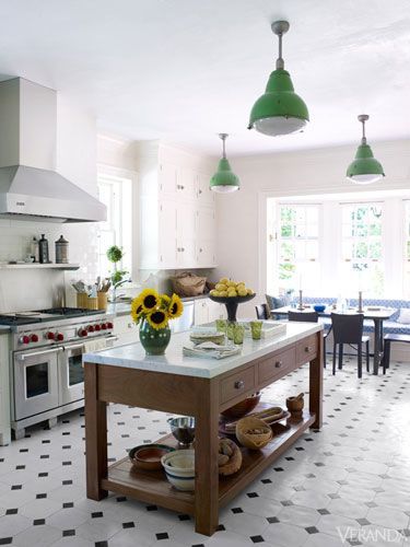 With black-and-white tiled floors and vintage pendants, this renovated kitchen seems pristinely original. Black Tiles Kitchen, White Subway Tile Kitchen, Kitchen Floor Tiles Ideas, Kitchen Tiles Design, White Tile Floor, Tiles Kitchen, White Subway Tiles, Black And White Tiles, Classic Kitchen