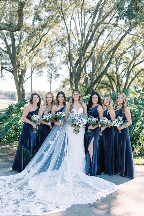 Orlando Wedding Planner - Plan It Events | Captured by Matlock & Kelly Photography | www.planitcfl.com/blog | blue velvet bridesmaids dresses | long bridal veil Winter Wedding Blue Bridesmaid, Velvet Teal Bridesmaid Dresses, Royal Blue Winter Bridesmaid Dresses, Wedding Blue Aesthetic, Blue Winter Wedding Bridesmaids, Dark Blue Green Bridesmaid Dresses, Storm Blue Wedding, Sparkly Blue Bridesmaid Dresses, Dusty Blue Velvet Bridesmaid Dresses