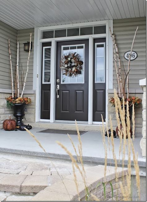 front door Sherwin Williams ‘Weathervane’ a deep chocolate brown color. It looks wonderful with the greige siding, the stone and brown roof.... Tan House, Brown Roof, Black Front Doors, Window Trim Exterior, Front Entryway, Pintura Exterior, Painted Front Doors, House Front Door, Exterior Paint Colors For House