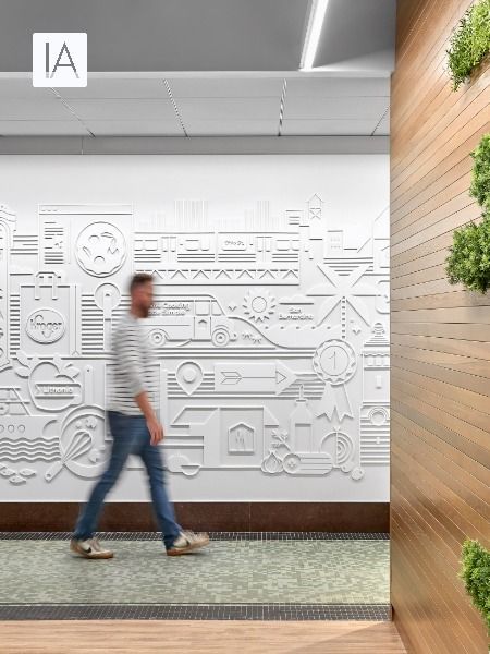 Raised white iconography behind a wooden wall help to tell the story of the Home Chef brand Office Graphic Wall, Environmental Graphic Design Wall, Office Branding Wall, Office Design Concepts, Experiential Graphics, Brand Wall, Office Wall Graphics, Office Graphics, Experiential Graphic Design