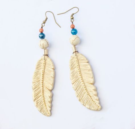 Boho gold feathers earrings made of polymer clay, micro beads, white and blue turquoise, sun stone . They are handcrafted by me in my home studio. Clay Feathers, Feathered Earrings, Modern Geometric Jewelry, Feathers Earrings, Gold Feather Earrings, Micro Beads, Sun Stone, Earrings Polymer, Resin Ideas