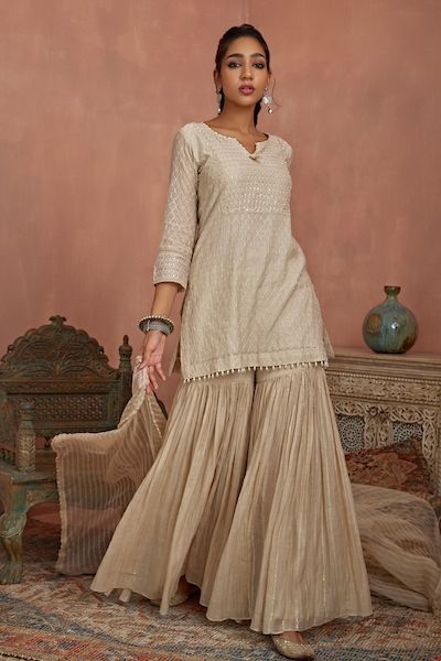 Buy Cream Chanderi Printed Gota Round Embroidered Kurta With Long Inner For Women by Peenacolada Online at Aza Fashions. Short Kurti With Sharara Designs, Sharara Models, Sharara Designs Simple, Simple Suits, Short Kurti Designs, Gharara Designs, Sharara Designs, Kurtis Tops, Kurti Style