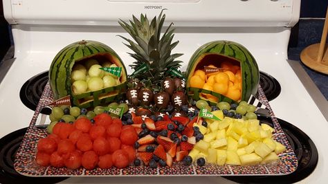 My superbowl fruit platter with chocolate covered strawberry footballs. Made by Angies Kitchen Superbowl Fruit Platter, Fruit Platter Football, Super Bowl Fruit Ideas Fun, Super Bowl Fruit, Football Helmet Fruit Bowl, Football Shaped Charcuterie Board, Stadium Snack Tray Super Bowl, Super Bowl Stadium Tray, Healthy Superbowl