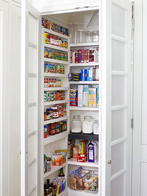 Make the most of a small pantry by outfitting each of the three walls with floor-to-ceiling shelving. Choose deeper, taller shelves for the back wall and short, narrow ledges on each side for cans, bottles, and other pint-size products. Reeded-glass doors hide the pantry's contents but keep the kitchen airy. Installing a pendant light inside the closet makes it easy to grab and go, especially a late-night snack. Vertical Pantry, Small Walk In Pantry, Melamine Shelves, Walk In Pantry Ideas, Narrow Pantry, Open Pantry, Shallow Shelves, Storage Pantry, Pantry Wall