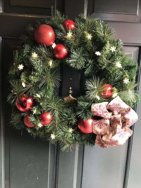 Christmas Wreath Took a plain wreath and added the lights, ornaments, and bow. The ornaments are from Home Depot from 2013 or 2014 and plastic. Used florist wiring to attach to the ornaments and then attach them to the wreath. The bow is from ribbon purchased from Michaels about four years ago as well. The lights are from Home Depot called Martha Living 18 LED snowflake lights. Pre Lit Christmas Wreaths, Plain Wreaths, Christmas Wreaths With Lights, Snowflake Lights, Lights Diy, Crafts With Pictures, Diy Lighting, Diy Wreath, Christmas Wreath