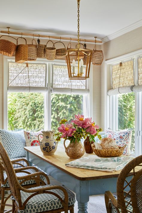 A whimsical breakfast nook design by @stephperezstudio featuring vintage hanging baskets, a rattan light fixture from @visualcomfort, an antique English farmhouse table and rattan dining chairs. Perfect for an English cottage inspired kitchen. Visit www.stephanieperez.com to work with us. Decorating Ideas For Kitchen, Vintage Decorating Ideas, Kitchen 2024, Cottagecore Home, Vintage Decorating, Ideas For Kitchen, Cottagecore Decor, Cottage Interiors, Cozy Kitchen