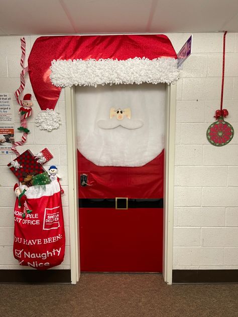 Santa Door Decoration Contest, metallic wrapping paper, quilt batting beard, loop yarn for hat, felt face,  scrap book paper belt, lots of hot glue… toy bag, empty boxes, ribbon and dollar store Christmas collection stuffed animals Santa Door Decoration, Door Decoration Contest, Cubicle Ideas, Santa Door, Christmas Door Decorating Contest, Christmas Classroom Door, Work Decor, Christmas Door Decoration, Door Decorating Contest