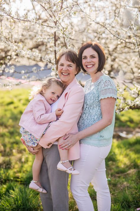 Three Generations - mother, daughter, and grandmother - captured beneath the blossoms in beautiful Great Country Farms in Northern Virginia in Bluemont during this spring family photo session with Virginia-based photographer Kathryn Lee Photography | family photoshoot | Northern Virginia | Washington DC | Richmond, VA | #kathrynleephotography Grandmother Mother And Daughter Pictures, Mom Daughter And Grandma Photo, Grandma Mommy And Me Photo, Grandmother Mother Daughter Photos, Mother Daughter And Granddaughter Photos, Mother Grandmother Daughter Photo Ideas, Grandma Mother Daughter Photos, Family Photo With Grandma, Grandma And Daughter Photography