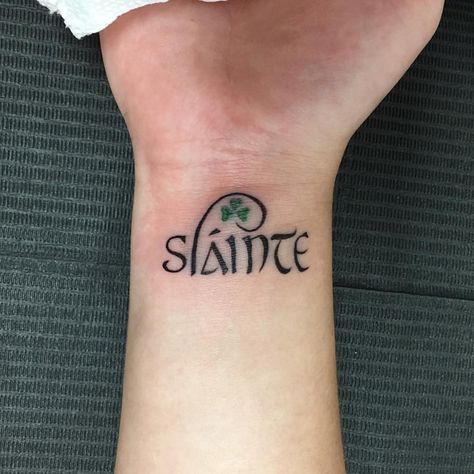 77 Likes, 1 Comments - nao (@naotattoos) on Instagram: “Sláinte means "health" in Gaelic and is commonly used as a drinking toast in Ireland and Scotland.…” Small Irish Tattoos, Newhaven Connecticut, Irish Sister Tattoos, Gaelic Tattoo, Ireland Tattoo, Tattoos For Dad Memorial, Irish Foods, Ireland And Scotland, Meaningful Wrist Tattoos