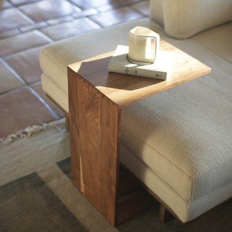 Endless uses for this side table include serving as a sofa table, workspace, or a dining table for one. It can also function as a plant stand, a guest room side table, an entryway organizer, or a kids' activity table. Create a designated reading nook by positioning the table near a comfortable chair or by the window. You can keep your current book, reading glasses, and a cup of tea or coffee on it, just to name a few possibilities. Laptop Sofa Table, Over The Couch Table, Behind Couch Ideas, Side Couch Table, Behind The Sofa Table, Makeshift Bar, Table For Couch, Urban Homes, Nyc Apt