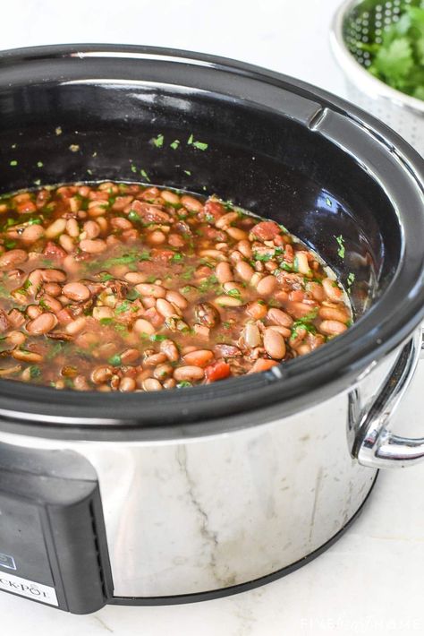 Slow Cooker Charro Beans ~ flavored with bacon, garlic, tomatoes, green chiles, jalapeños, cilantro, and spices and cooked in the crock pot to make them hands-off and truly effortless...the perfect side dish for Mexican food! | FiveHeartHome.com Charro Beans Recipe Crockpot, Crock Pot Charro Beans Slow Cooker, Ranchero Beans Crockpot, Mexican Beans Recipe Crockpot, Mexican Beans Recipe Slow Cooker, Churro Beans Crockpot, Best Bean Recipes Crock Pot, Charro Beans In Crockpot, Crockpot Frijoles Charros