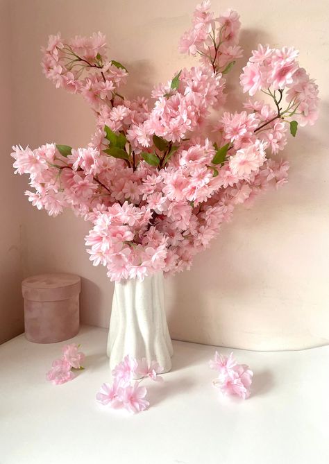 "Beautiful our signature cherry blossom bouquet in a cute packaging and a little card attached saying \" happiness blooms from within\" or \"flowers make me happy\" . Two cards to choose from. Quality cherry blossom stems. Each bouquet has 3 stems. And comes in 2 colours - white/ivory and light pink. Perfect gifting idea, Great adding to vases this spring or all year round. Approx. height 60 cm. Any questions, ask away." Sakura Flower Bouquet, Cherry Blossom Flower Bouquet, Sakura Bouquet, Cherry Blossom Arrangement, Baby Pink Flowers, Cherry Blossom Bouquet, Spring Flowers Garden, Spring Flower Garden, Blossom Bouquet