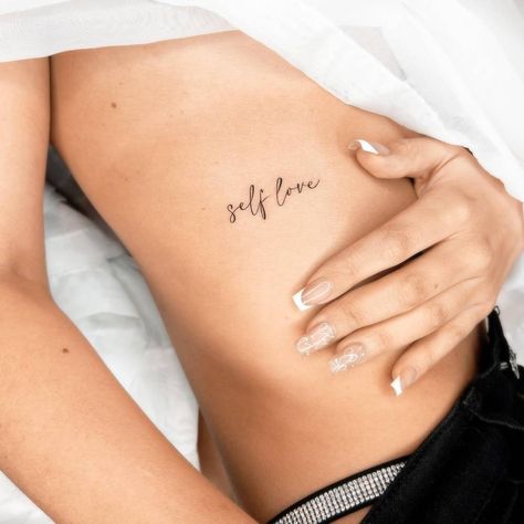 "Self love" lettering tattoo located on the rib. Self Love Rib Tattoo, Rib Tattoo Script, Script Quotes, Left Quotes, Script Tattoos, Quotes For Tattoos, Self Love Tattoo, Lettering Tattoo, Tattoo Script