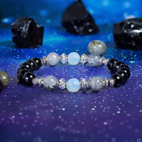 Handcrafted On A Tension Tested Stretch Cord With Authentic Obsidian, Opalite, And Labradorite Gemstones. Labradorite Is A Stone Of Realization, Believed To Help Its Wearer Awaken Their Inner Consciousness. The Stone Can Sometimes Display An Iridescent Optical Effect Known As "Labradorescence," Where Light Enters The Stone And Is Reflected From A Sub-Surface Within The Stone. Obsidian Is A Stone Of Warding, Believed To Help Bring Balance To Scattered Energies. The Stone's Metaphysical Uses Date Opalite Bracelet, Crystal Combinations, Mala Jewelry, Diy Necklaces, Obsidian Bracelet, Bracelets With Meaning, Black Beaded Bracelets, Bracelets Design, Beads Bracelet Design