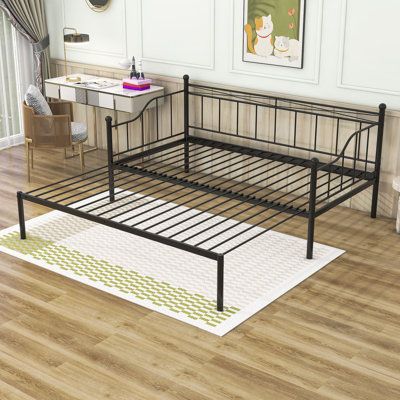 This daybed is equipped with a trundle, which can be easily pulled out to increase the usable area of the bed, and the trundle can also be pushed in to save space. It is made of sturdy metal, with a powder coating finish and metal slats support to ensure long-term stability and durability. The three sides of the bed are equipped with guard rails to prevent you from falling accidentally. The spacious space under the bed can be used to store daily necessities and help you tidy up the room. Actual Day Bed With Pop Up Trundle, Daybed In Office, Pop Up Trundle Bed, Iron Daybed, Metal Daybed With Trundle, Pop Up Trundle, Diy Daybed, Twin Trundle Bed, Metal Daybed