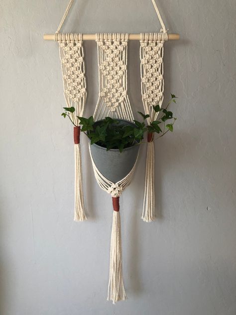 **Please read full description for size details** This small macrame wall plant hanger is  perfect for your favorite small plant or decorative pot.  This product is hand-knotted so each item may vary slightly from the next, that's one of the unique qualities of handmade macrame!  This plant hanger is made with 3 mm Off-white cotton rope and Orchid color 4 mm rope for wrap knot. This plant hanger is capable of holding pots with a base diameter of up to about 3 inches.  Recommended max height of p Macrame Wall Plant Hanger, Plant Hanger Wall, Wall Plant Hanger, Plants Pots, Small Macrame, Orchid Color, Hanger Wall, Hanging Home Decor, Decorative Pots