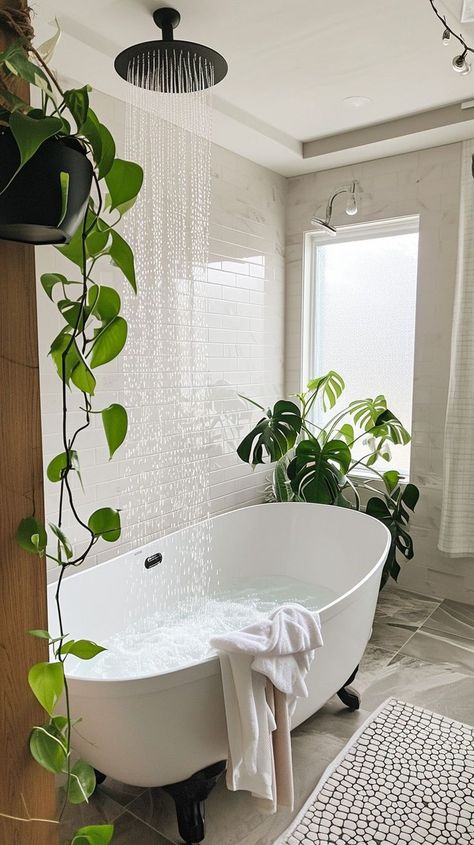 Serene bathroom oasis with a freestanding bathtub, bubbles, green plants, and rain showerhead - ideal for relaxation and tranquility at home Bathroom Greenery, Bathroom With Plants, Stand Alone Bath Tub, Home Retreat, Relaxing Home, Stand Alone Tub, Serene Bathroom, Bathroom Oasis, Under The Rain