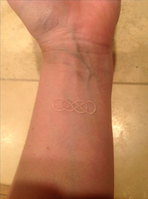 White ink double infinity tattoo - if I ever get a tattoo i want to get that and under it say beautiful. Infinity Tattoo On Finger, Double Infinity Tattoo, Tattoo White Ink, Someday Tattoo, Double Infinity Tattoos, Gold Tattoo Ink, Adoption Tattoo, Tattoo On Finger, Infinity Tattoo On Wrist