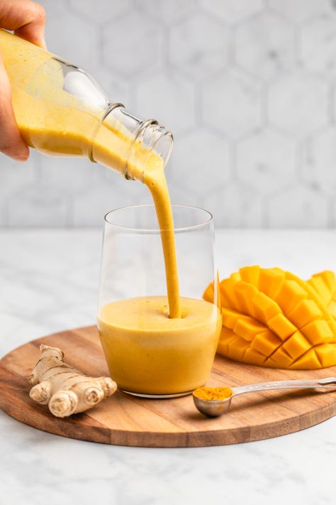 This Golden Milk Mango Smoothie is tangy, refreshing, and extra cozy. The perfect year-round smoothie, made from only 9 wholesome ingredients. Mango Juice Aesthetic, Golden Milk Recipe, Mint Smoothie, Almond Smoothie, Milk Smoothie, Mango Juice, Golden Milk, Mango Recipes, Mango Smoothie