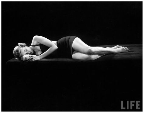 Model lying on side demonstrating relaxed sleeping position NYC 1943 Gjon Mili Gjon Mili, Sun Worship, People Lie, Side Sleeping, Sleeping Positions, Cat People, Life Photo, Life Magazine, Shades Of Black