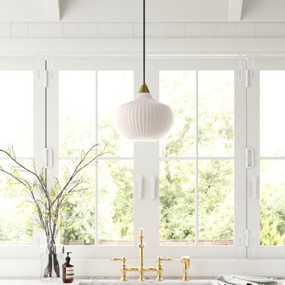 This mid-century modern pendant light offers Art Deco-inspired details designed to draw the eye. It's crafted from metal with a ribbed abstract globe-shaped shade designed to draw the eye. This pendant includes a circular ceiling canopy that's compatible with sloped ceilings and a single hanging cord. Thanks to its adjustable height, you have the flexibility to hang it just about anywhere. Its compact 12" wide silhouette is great for adding over a kitchen table, in an entryway, or over your read Pendant Light Over Kitchen Sink, Light Over Kitchen Sink, Kitchen Sink Lighting, Dome Pendant Lighting, Island Pendant Lights, Kitchen Lighting Fixtures, Kitchen Island Pendants, Drum Chandelier, Kitchen Pendants