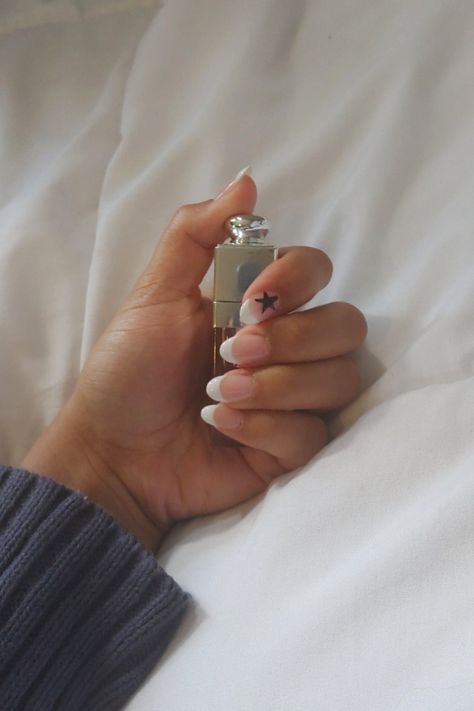 Aesthetic nail inspo, nail inspo, coquette nails, aesthetic nails, acrylic nails, downtown girl, rockstars girlfriend Almond French Tip With Stars, Nails With Star On Ring Finger, French Tip With Star On Ring Finger, White French Tip With Stars, Rockstar Girlfriend Aesthetic Nails, Star French Tips, Rockstar Girlfriend Nails, French Tip Star Nails, French Tip With Stars